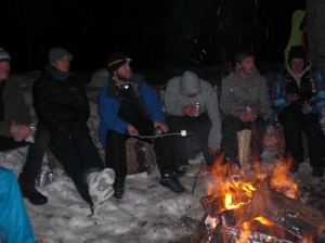 Liftys toasting marshmallows around the campfire