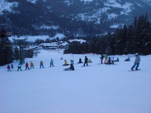 snowboarders group together on the slope